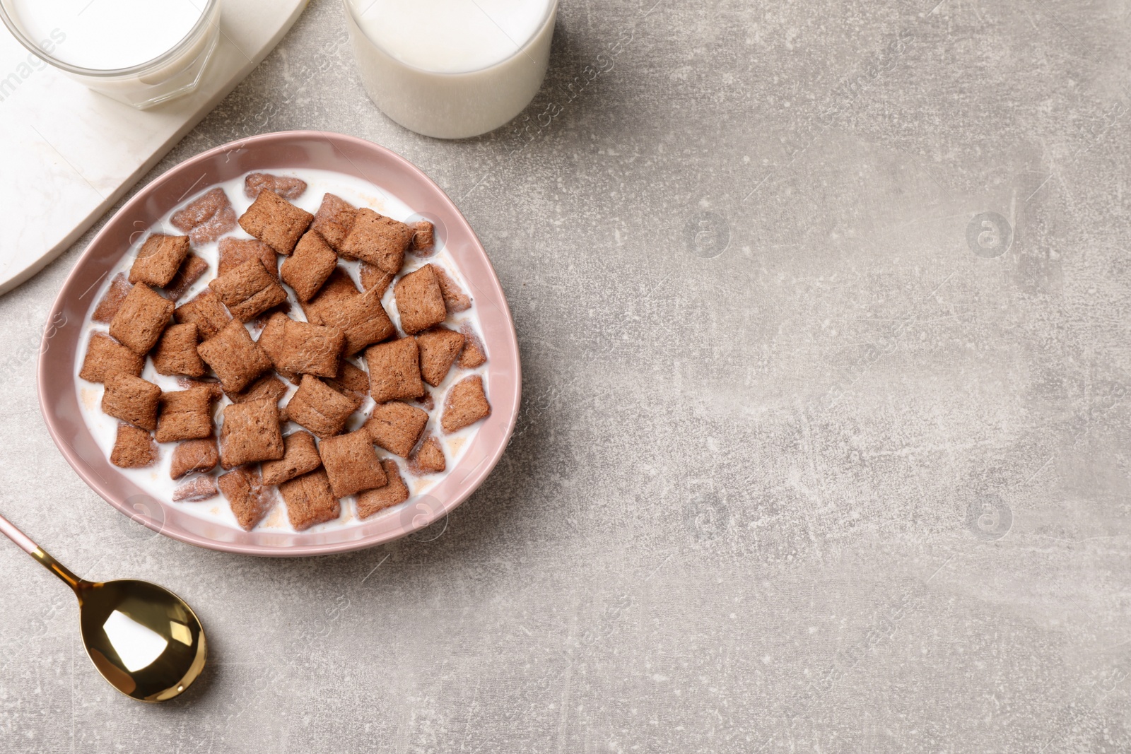 Photo of Tasty corn pads with milk served on light table, flat lay. Space for text