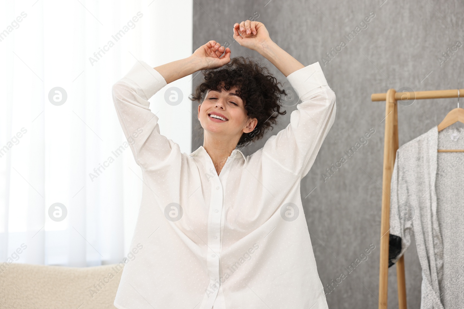 Photo of Beautiful young woman in stylish pyjama at home