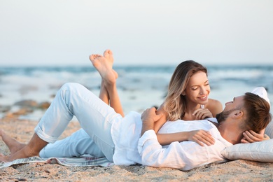 Young couple spending time together on beach