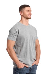 Photo of Man wearing grey t-shirt on white background. Mockup for design