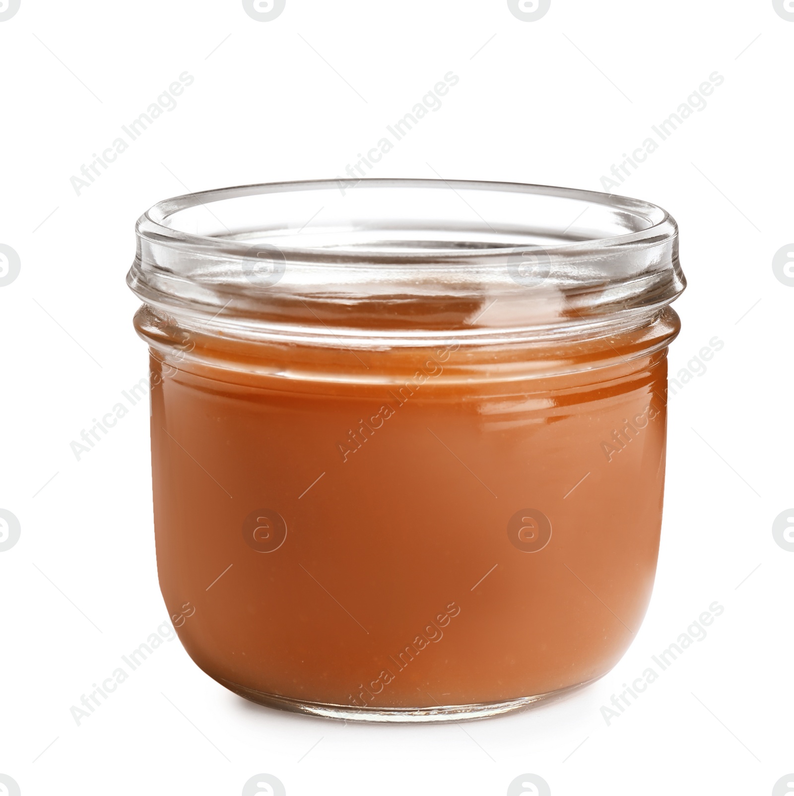 Photo of Jar of tasty caramel sauce isolated on white