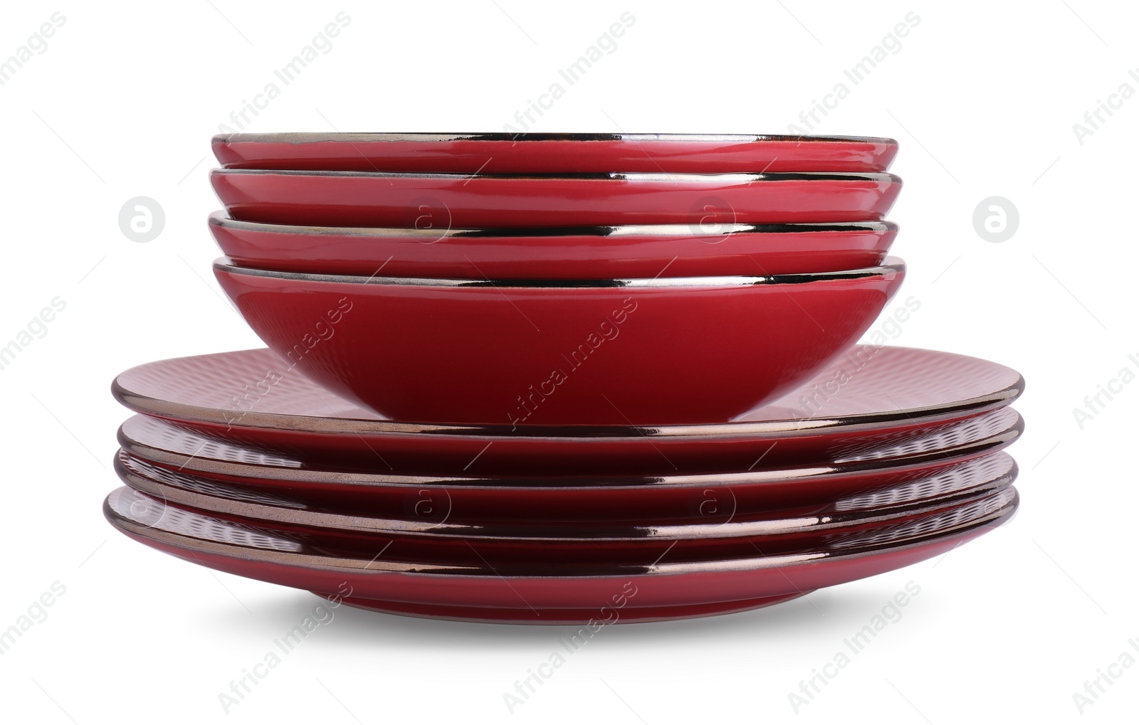 Photo of Stack of red bowls and plates isolated on white