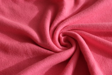 Photo of Beautiful pink fabric as background, closeup view