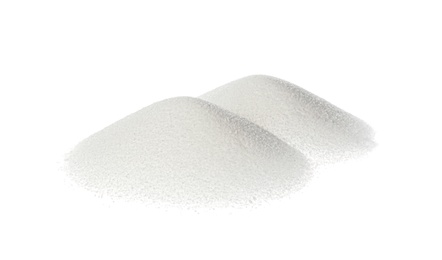 Piles of natural salt isolated on white