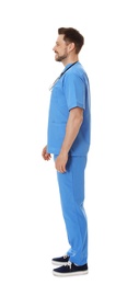 Full length portrait of smiling male doctor in scrubs isolated on white. Medical staff