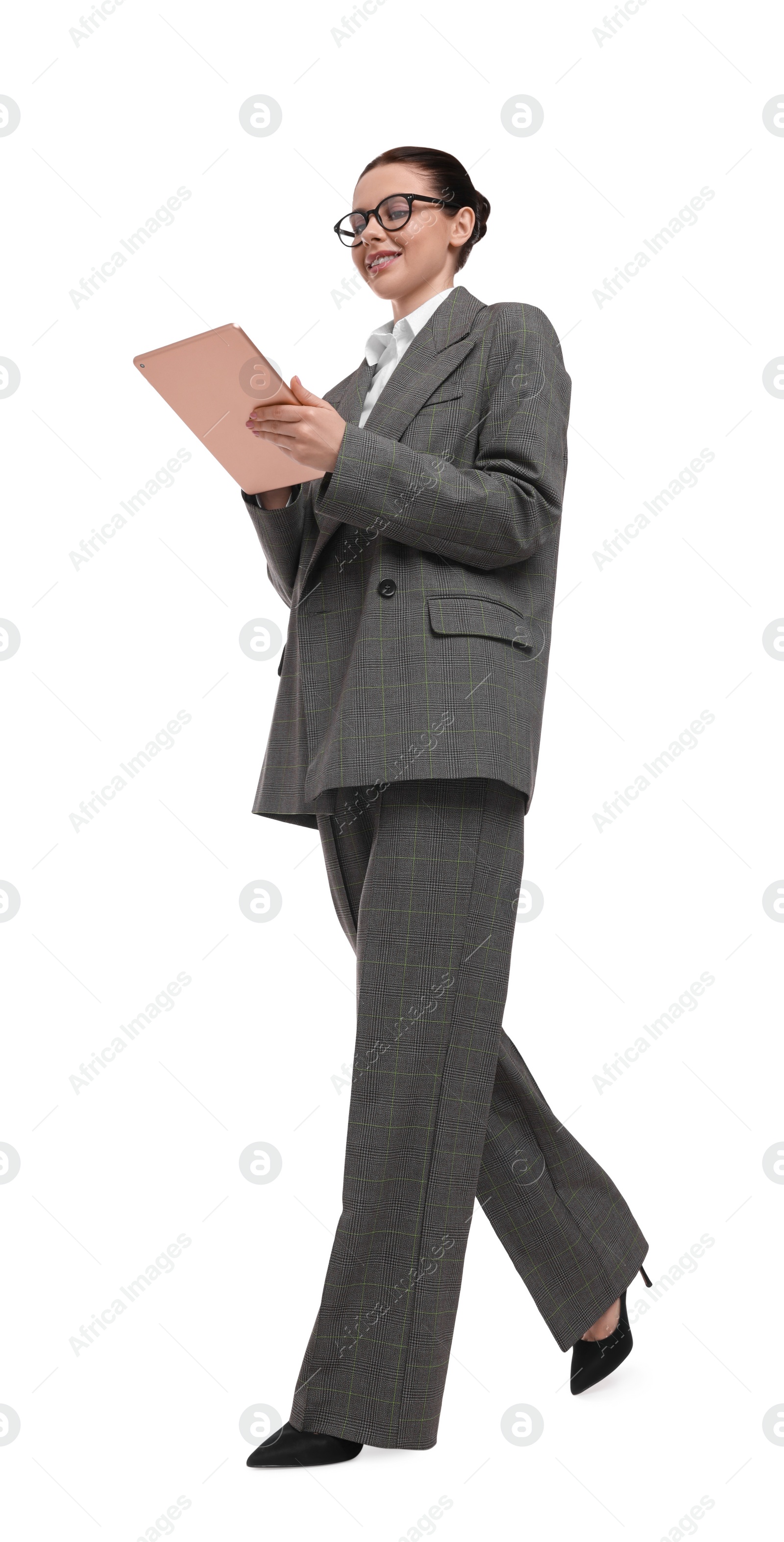 Photo of Beautiful businesswoman in suit with tablet on white background