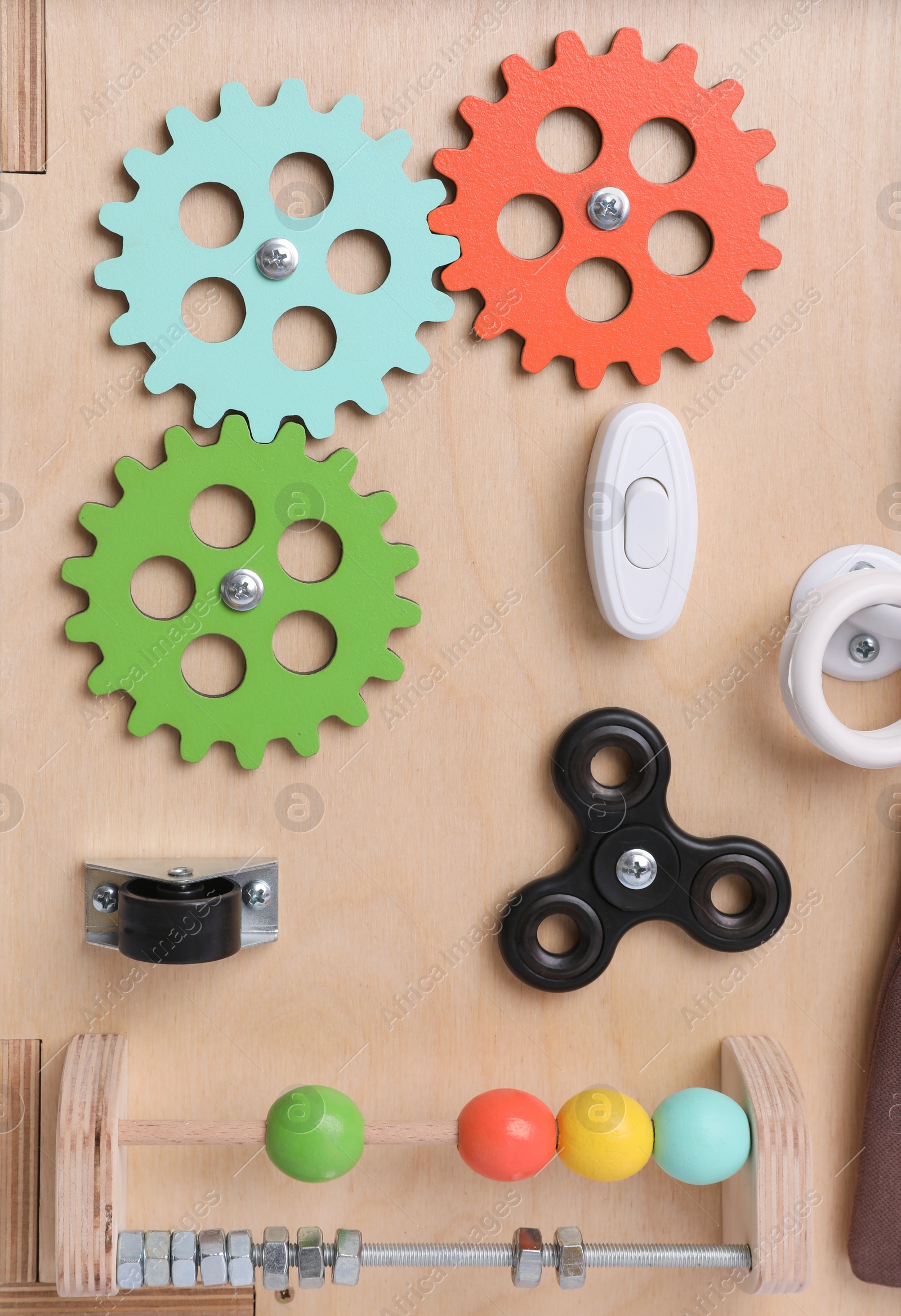 Photo of Closeup view of busy board. Baby sensory toy