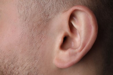 Photo of Closeup view of man, focus on ear