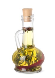 Photo of Glass jug of cooking oil with spices and herbs isolated on white