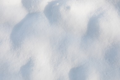 Photo of White snow as background, top view. Winter season