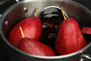 Image of Poaching pears in mulled wine, closeup view
