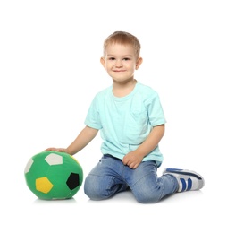 Photo of Cute little child with soft soccer ball on white background. Playing indoors