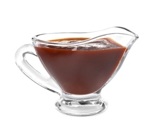 Photo of Glass gravy boat with barbecue sauce on white background