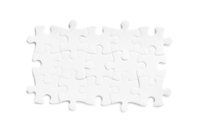 Photo of Blank puzzle pieces isolated on white, top view