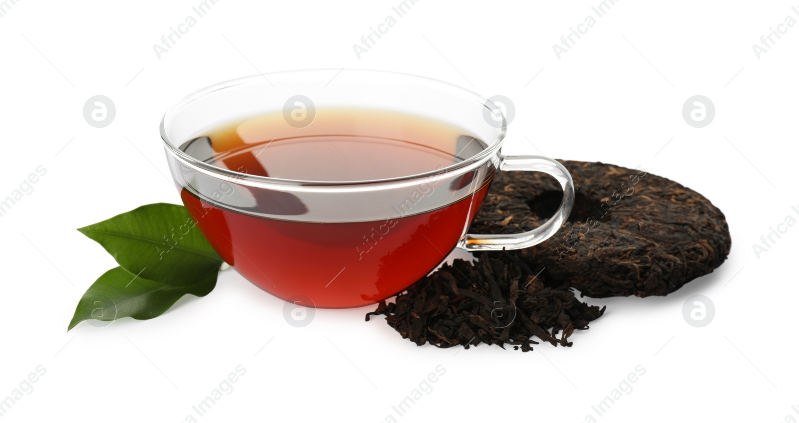 Traditional Chinese pu-erh tea, freshly brewed beverage and green leaves isolated on white Photo of Traditional Chinese pu-erh tea, freshly brewed beverage and green leaves isolated on white