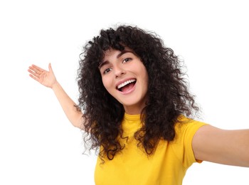 Photo of Beautiful young woman taking selfie on white background