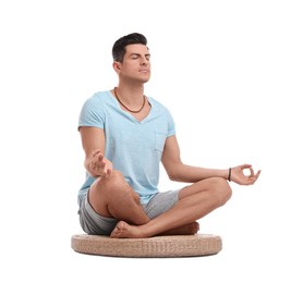 Photo of Man meditating on white background. Zen concept