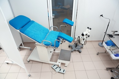 Photo of Gynecological examination chair in doctor's office. Health checkup
