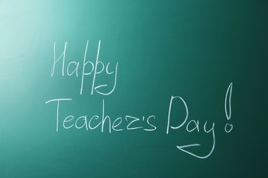 Photo of Green chalkboard with inscription HAPPY TEACHER'S DAY