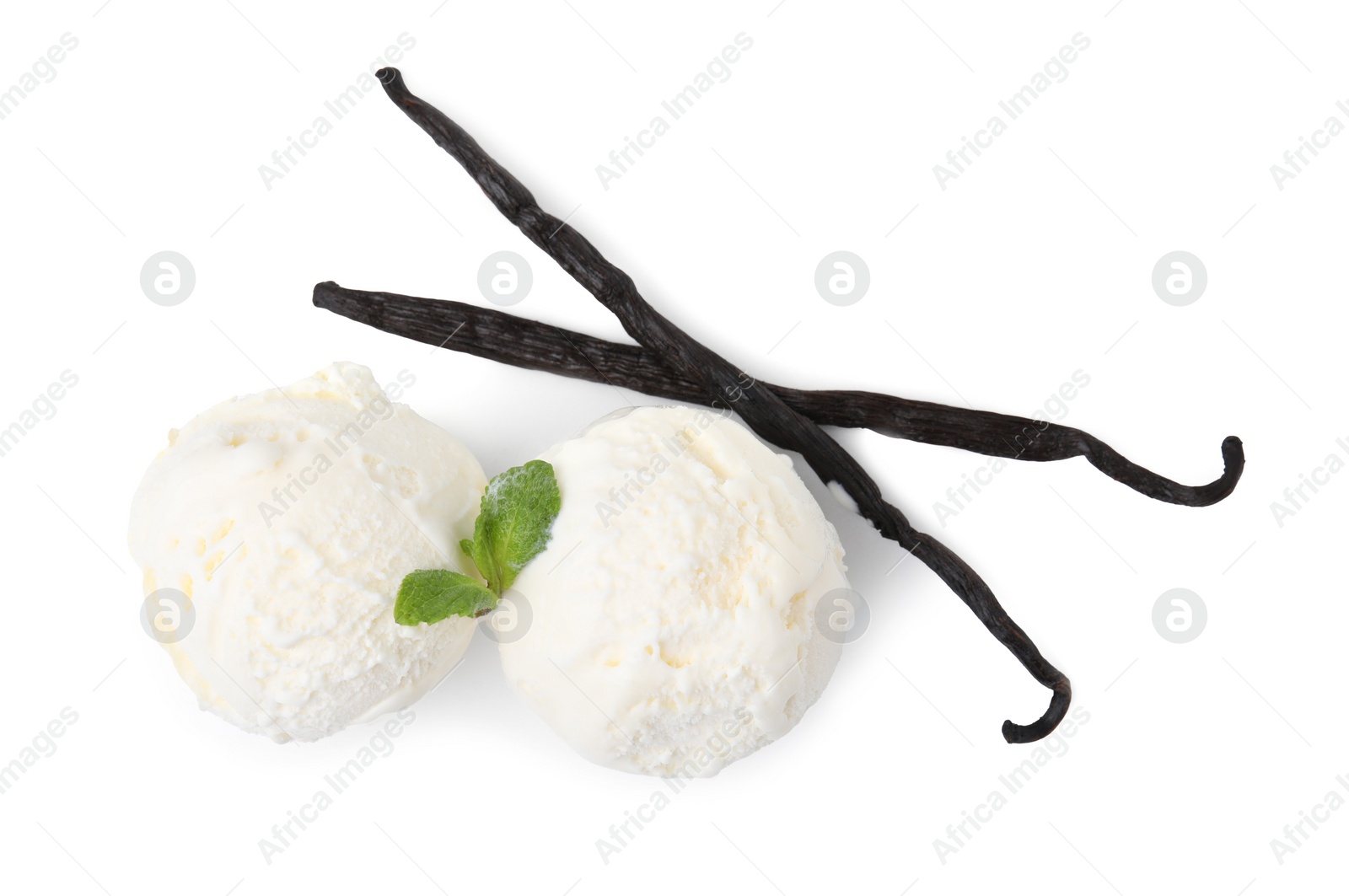 Photo of Delicious ice cream with mint and vanilla pods isolated on white, top view