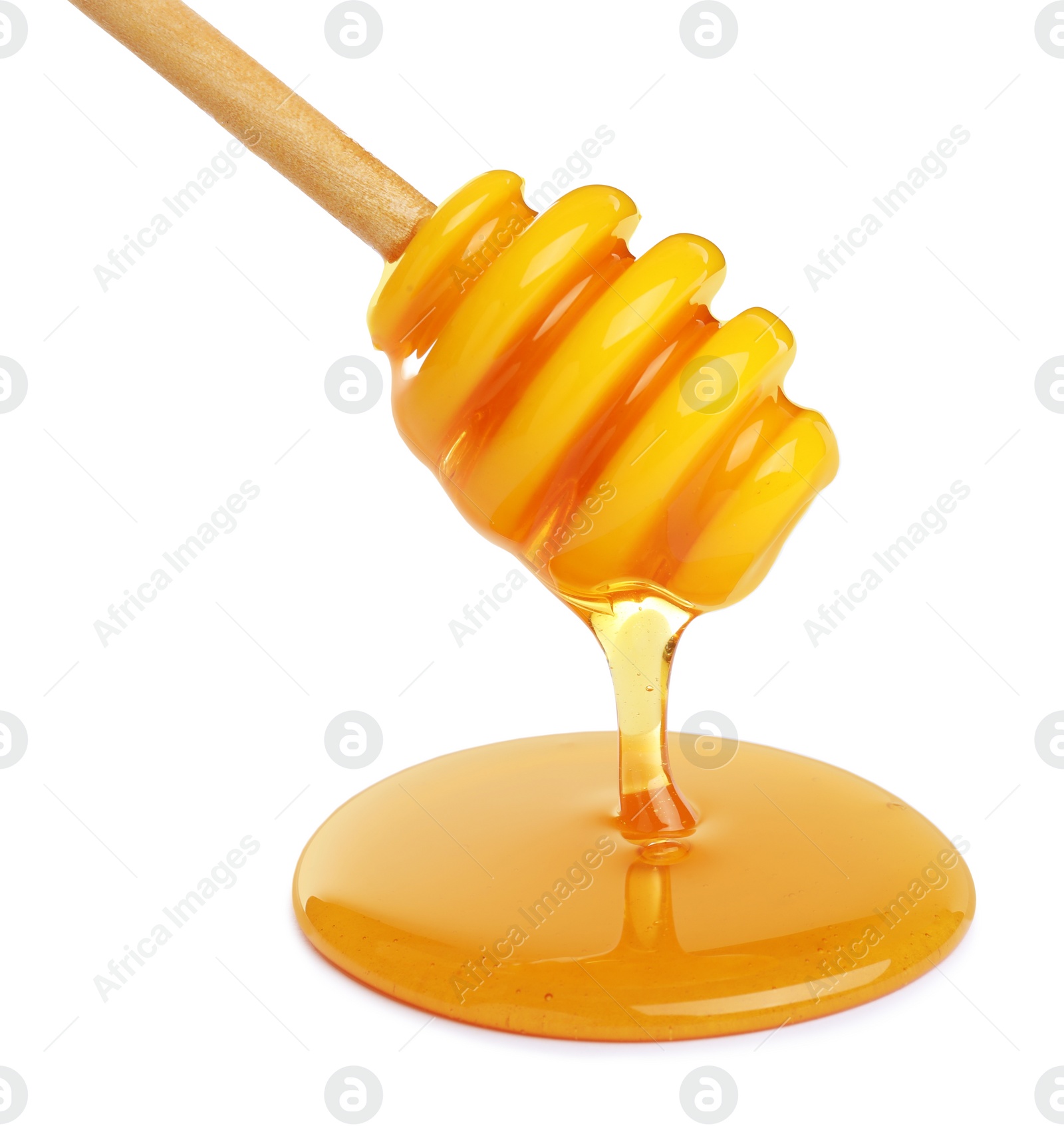 Photo of Honey dripping from dipper on white background