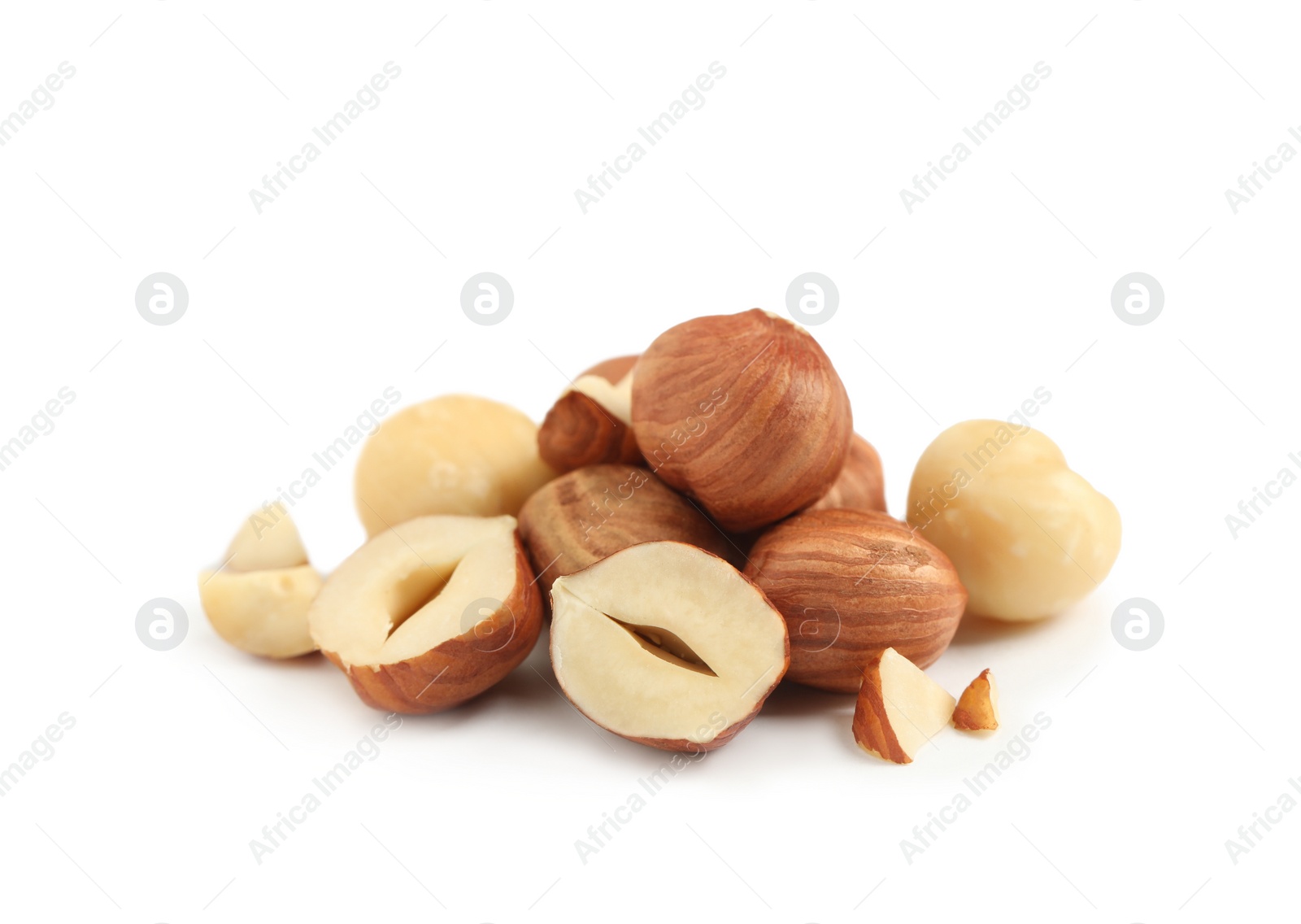 Photo of Heap of tasty hazelnuts on white background