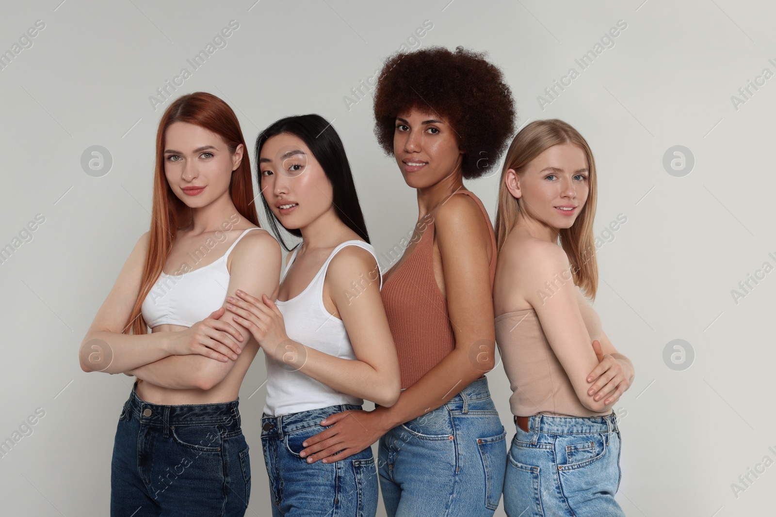 Photo of Portrait of beautiful young women on light grey background