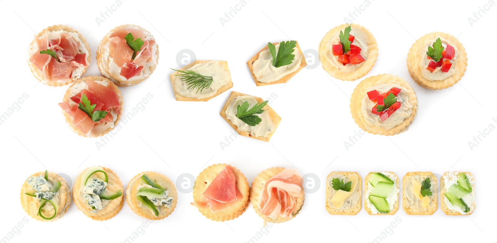 Image of Delicious crackers with different toppings isolated on white, top view