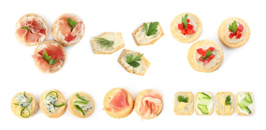 Image of Delicious crackers with different toppings isolated on white, top view