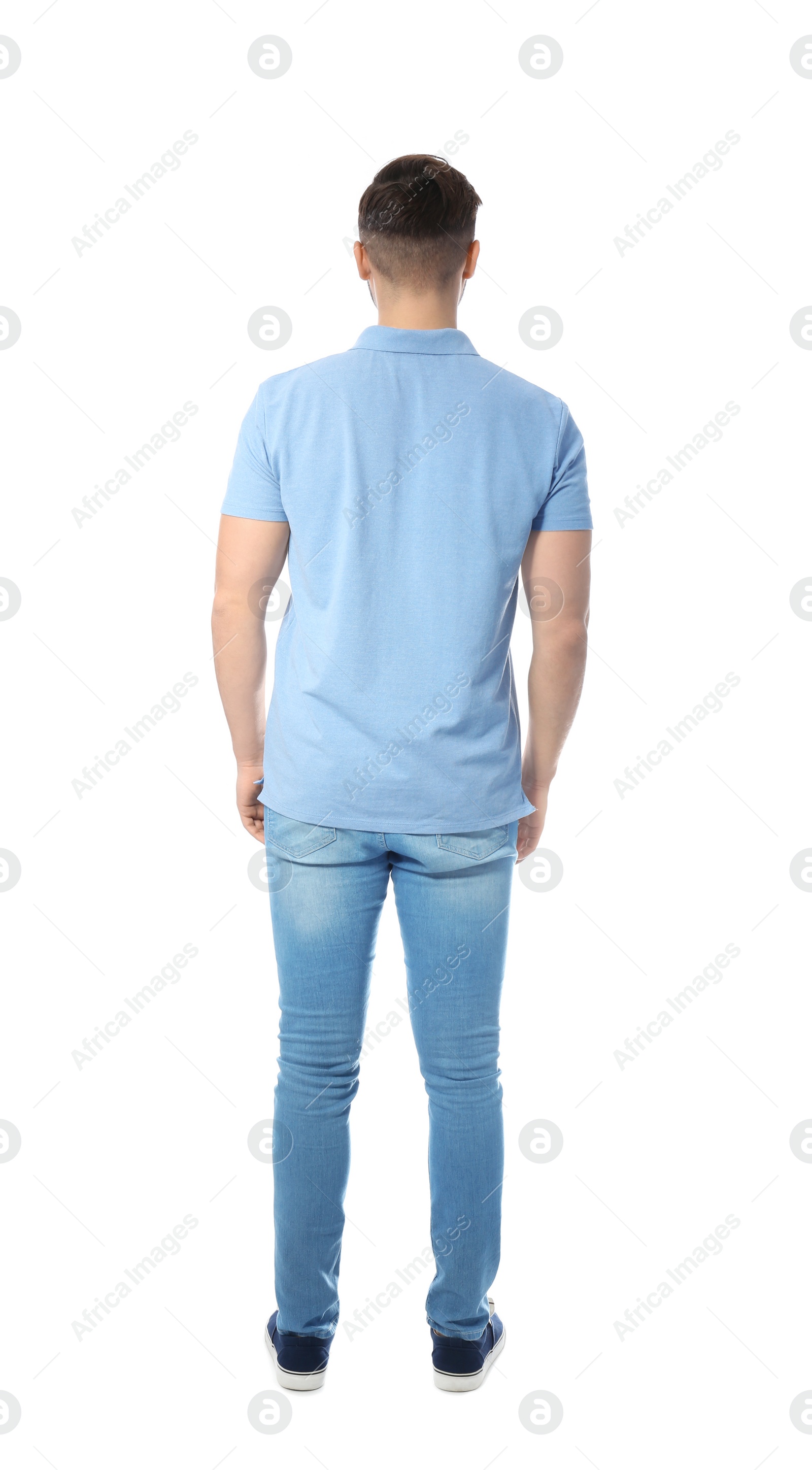 Photo of Young man in casual clothes posing on white background