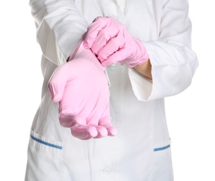 Doctor wearing medical gloves on white background