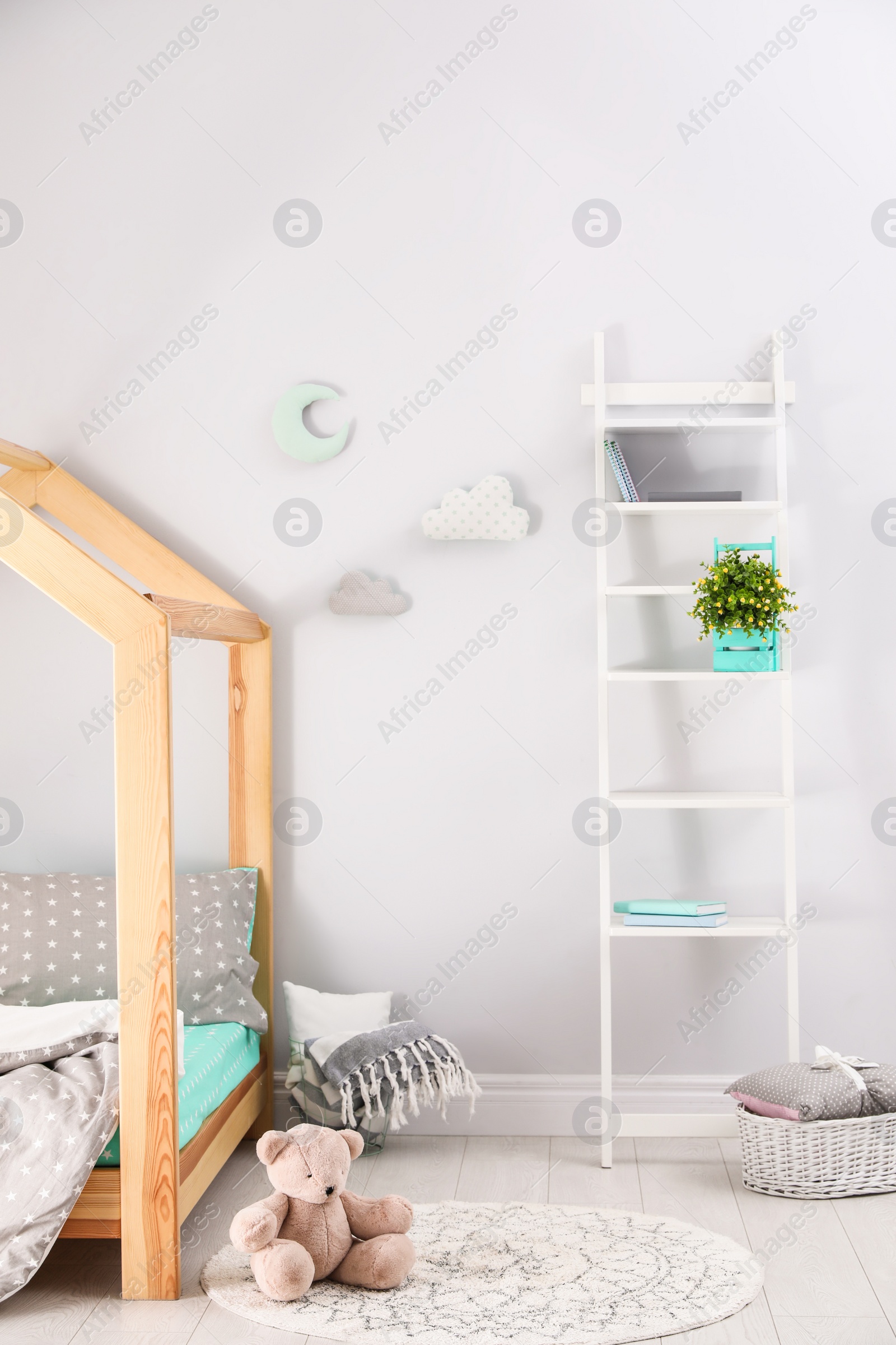 Photo of Stylish child room interior with comfortable bed