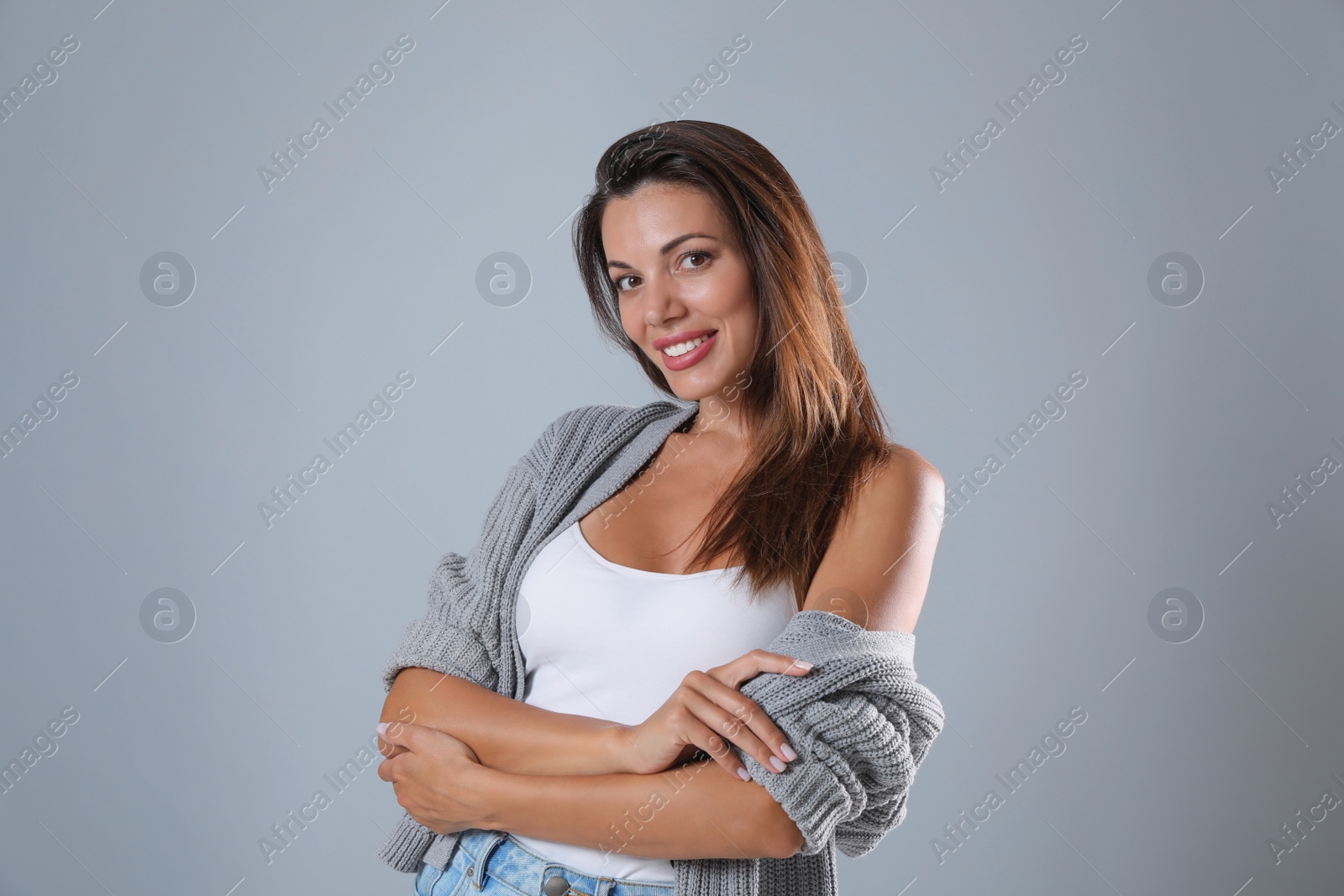 Photo of Portrait of beautiful woman on light grey background