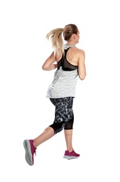 Sporty young woman running on white background