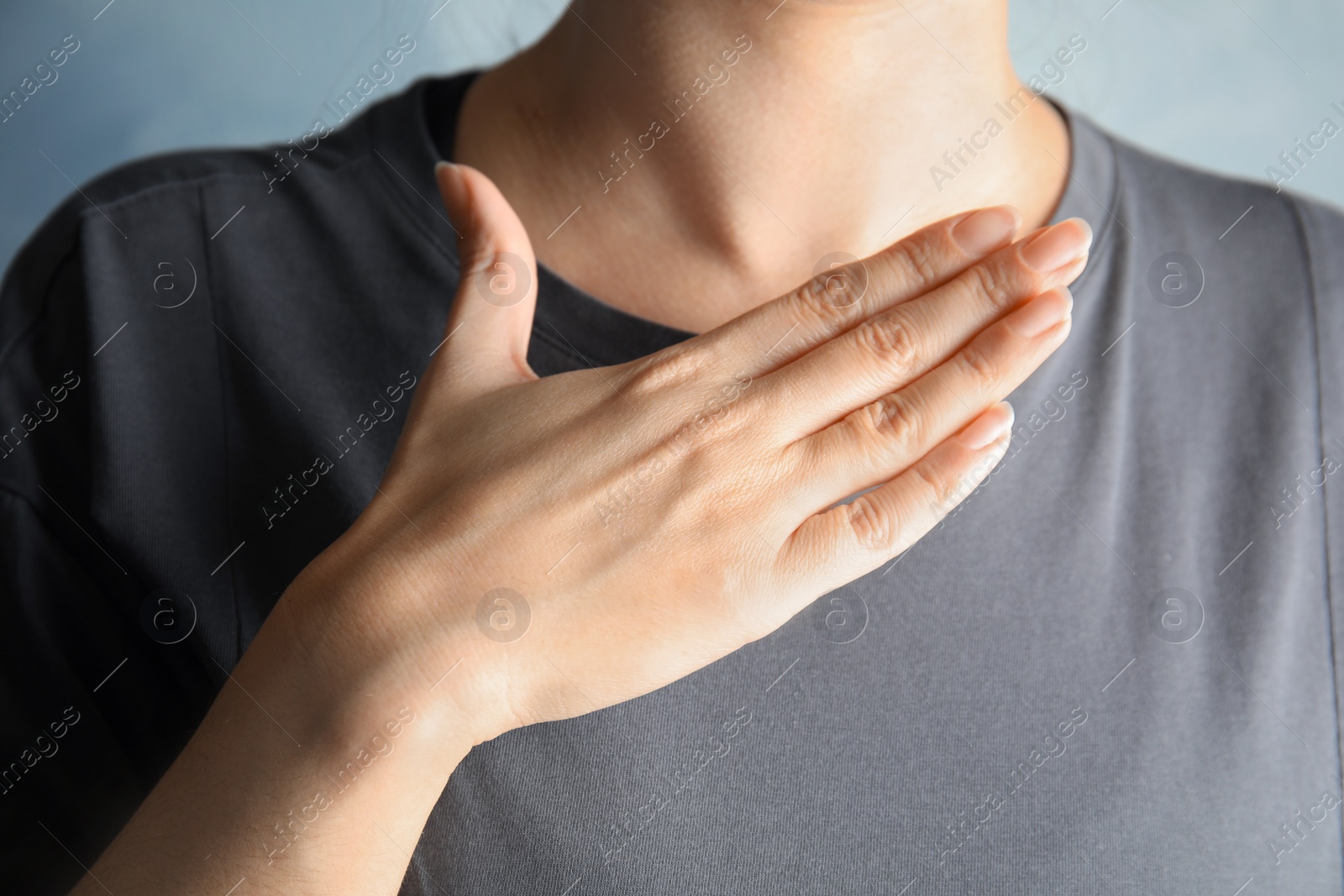 Photo of Woman showing word happy, closeup. Sign language