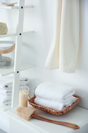 Photo of Clean towels and sponges on table indoors