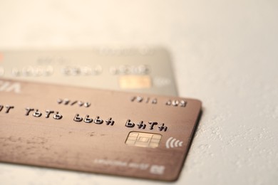 Two credit cards on gray background, closeup