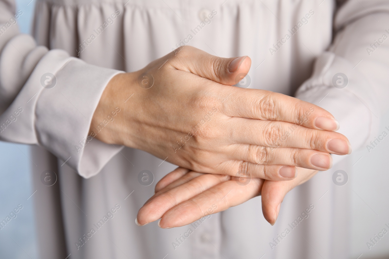 Photo of Woman showing word stop, closeup. Sign language