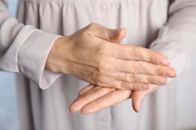 Woman showing word stop, closeup. Sign language