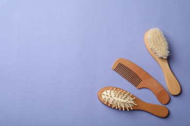 Bamboo brushes and space for text on lavender background, flat lay. Conscious consumption