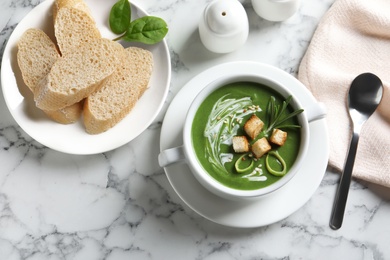 Fresh vegetable detox soup with croutons served on table, top view