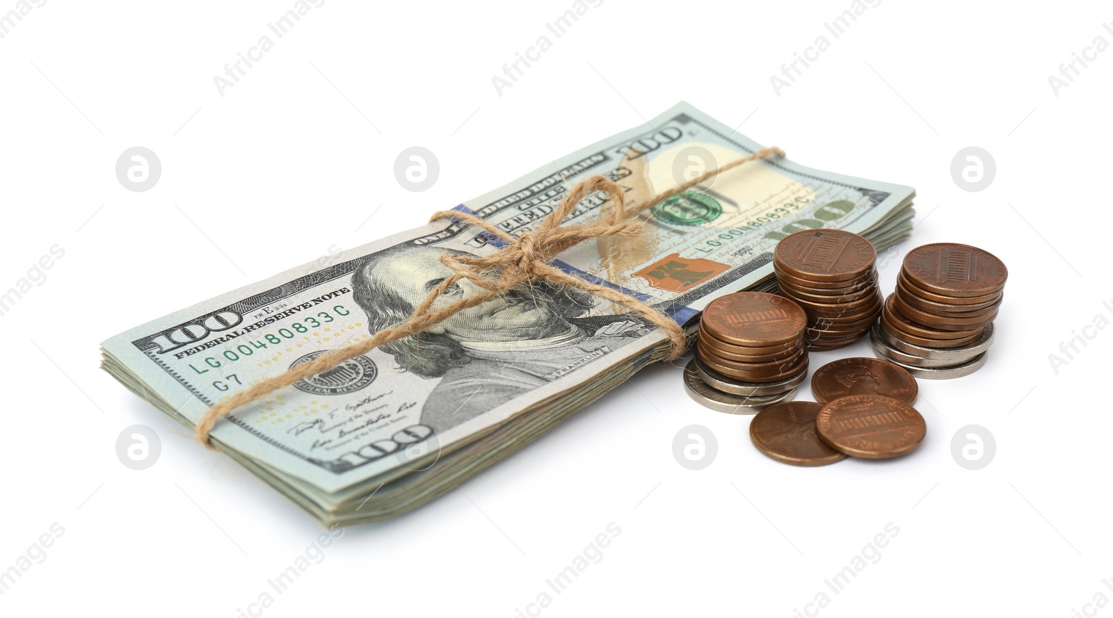 Photo of Dollar banknotes and stacks of coins on white background