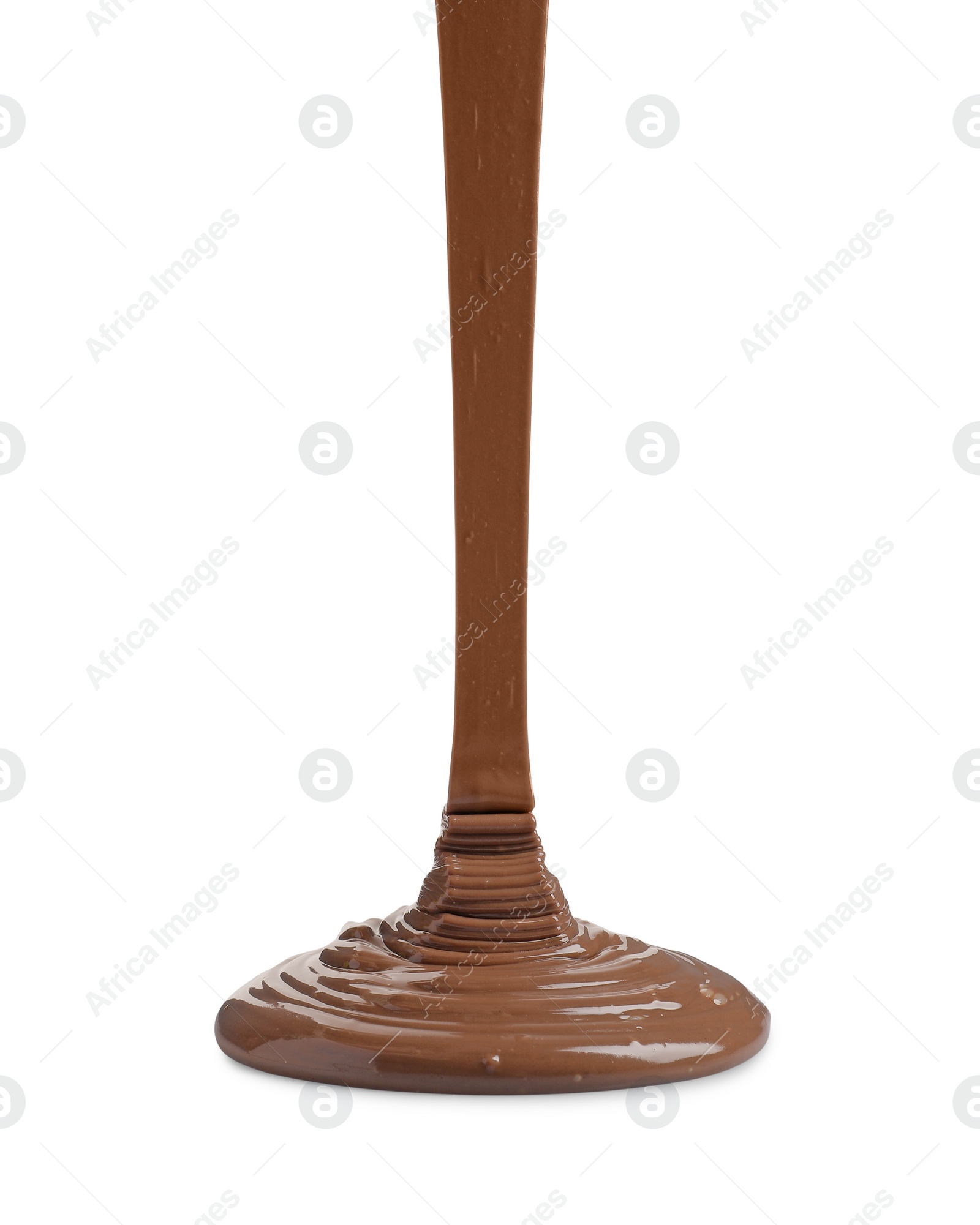 Photo of Pouring tasty melted milk chocolate isolated on white