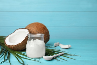 Composition with coconut oil on wooden table. Healthy cooking