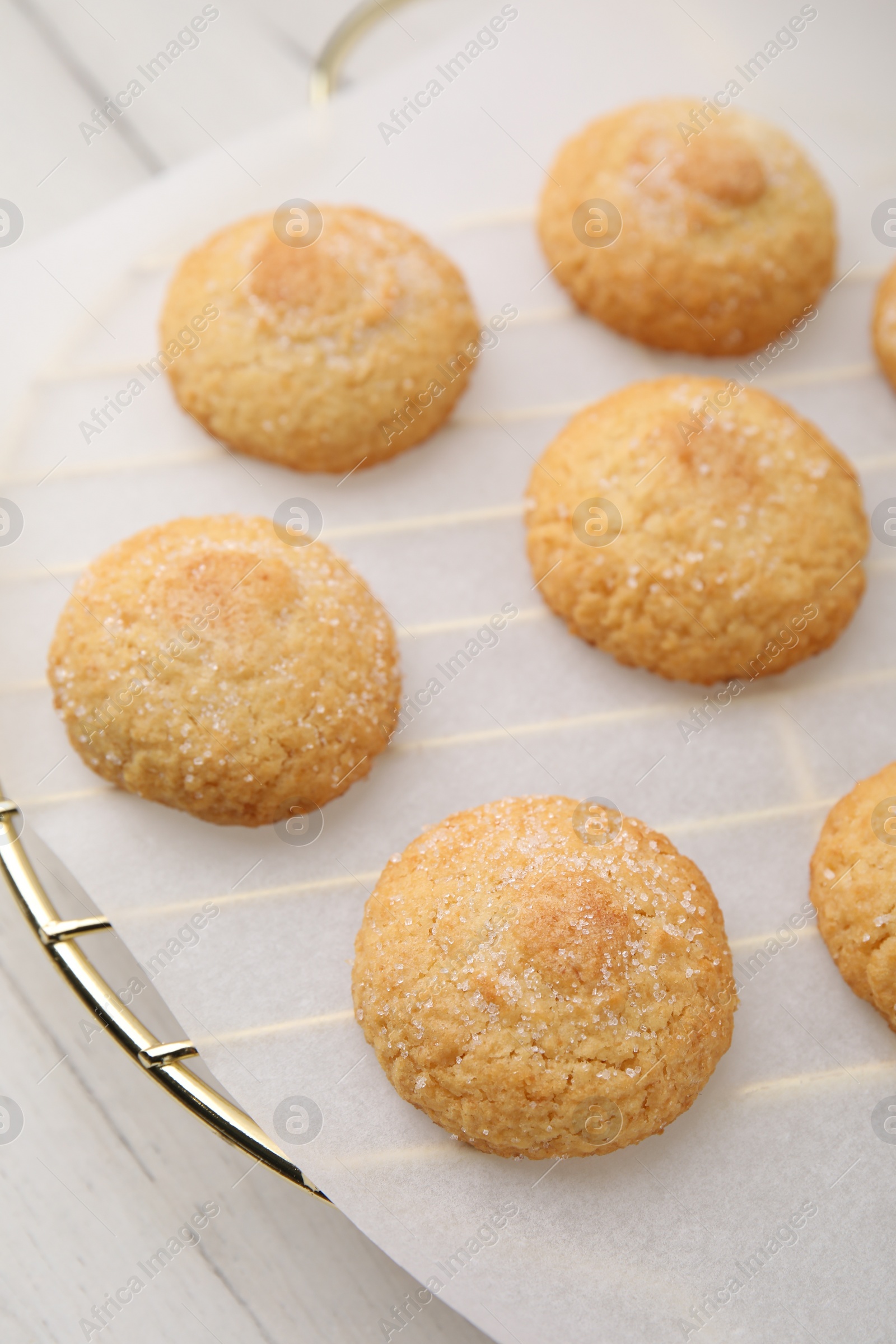 Photo of Tasty sweet sugar cookies on white wooden table, closeup