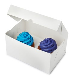 Box with delicious cupcakes on white background