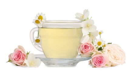 Photo of Aromatic herbal tea in glass cup and flowers isolated on white