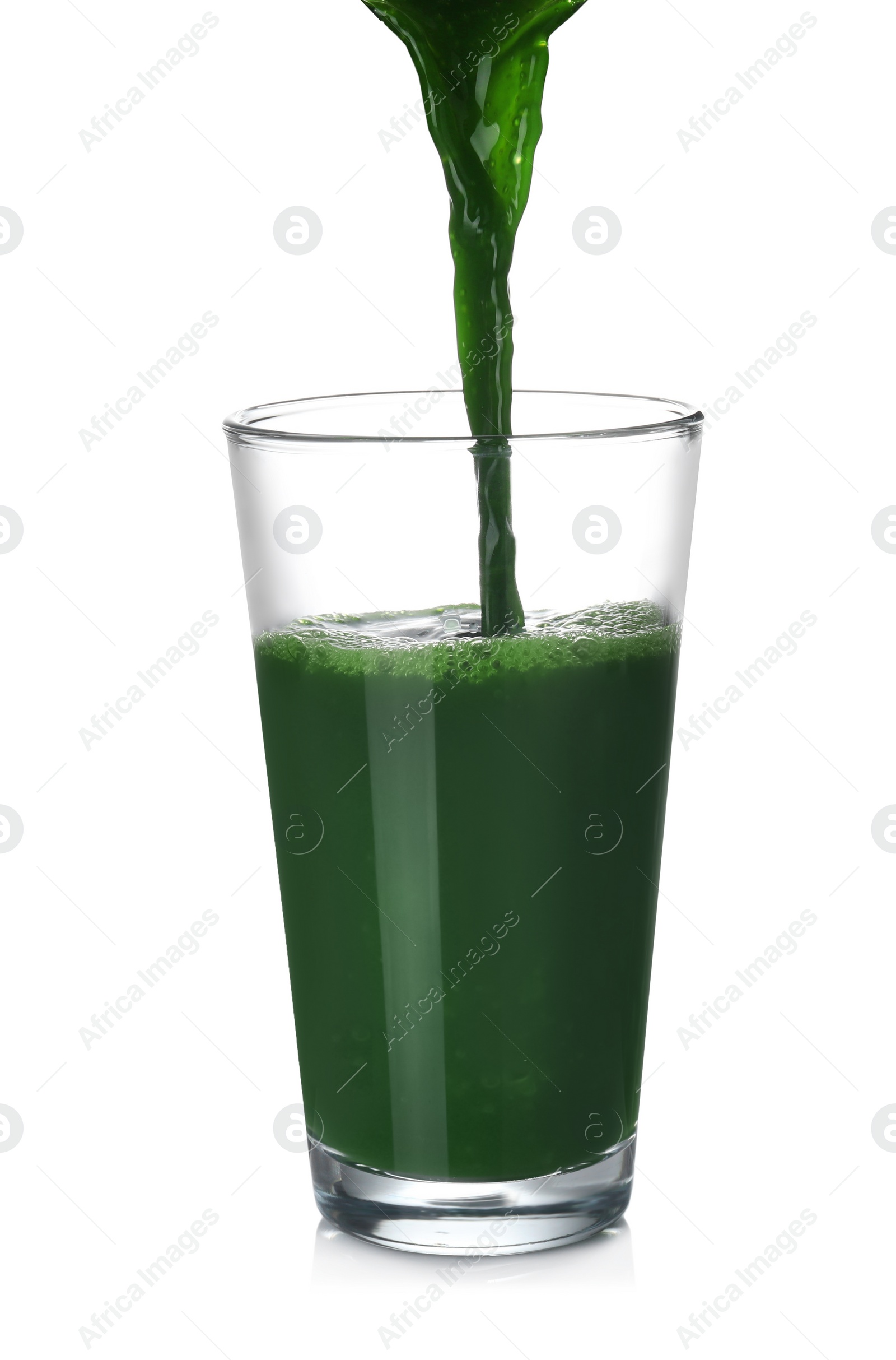 Photo of Pouring fresh juice into glass on white background