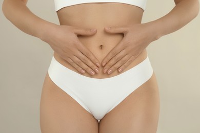 Photo of Gynecology. Woman in underwear on light background, closeup