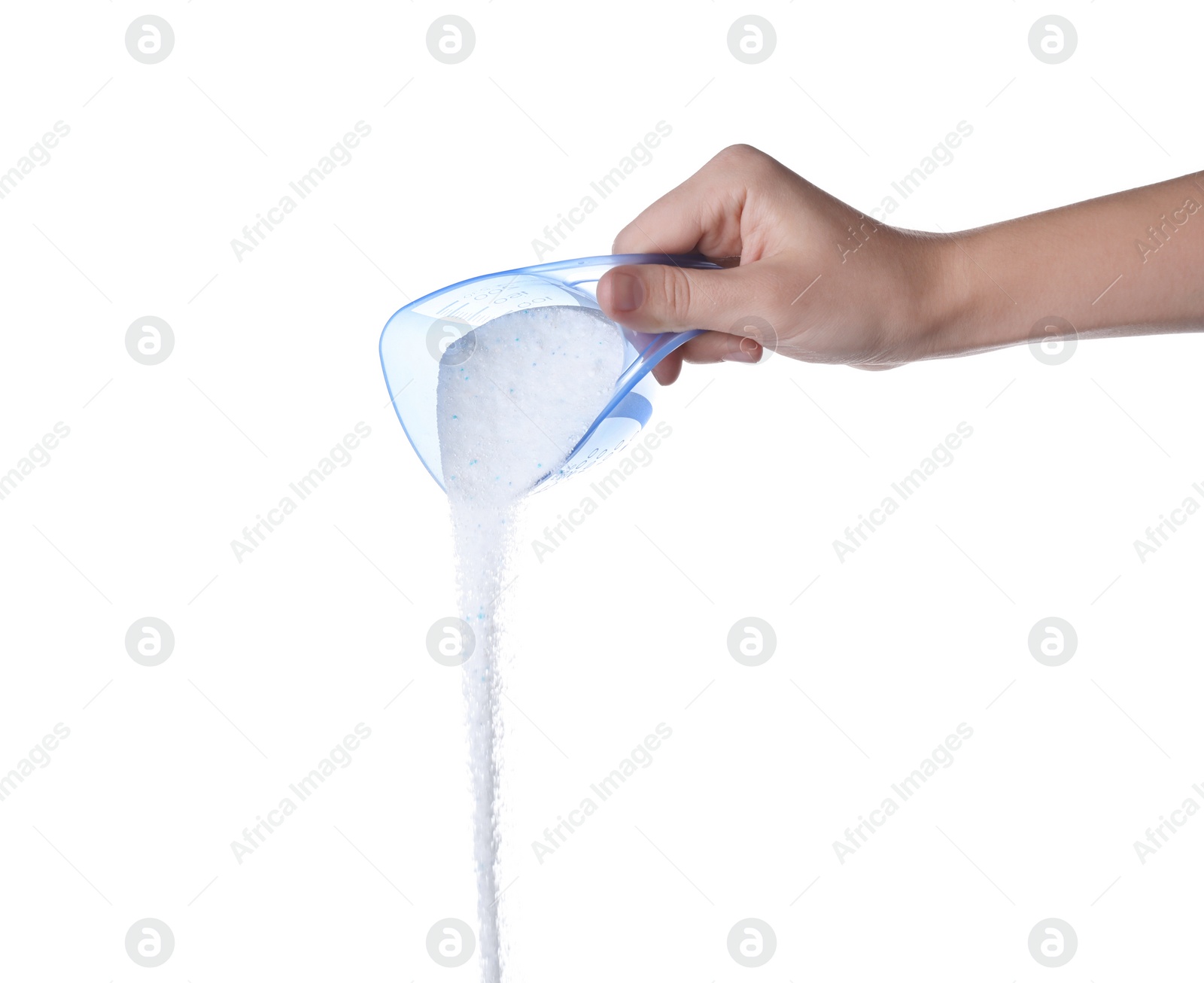 Photo of Woman pouring laundry detergent from measuring container against white background, closeup